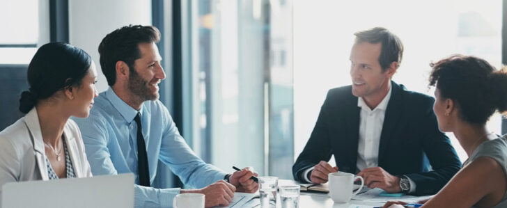 Business lawyers meeting with clients in a room