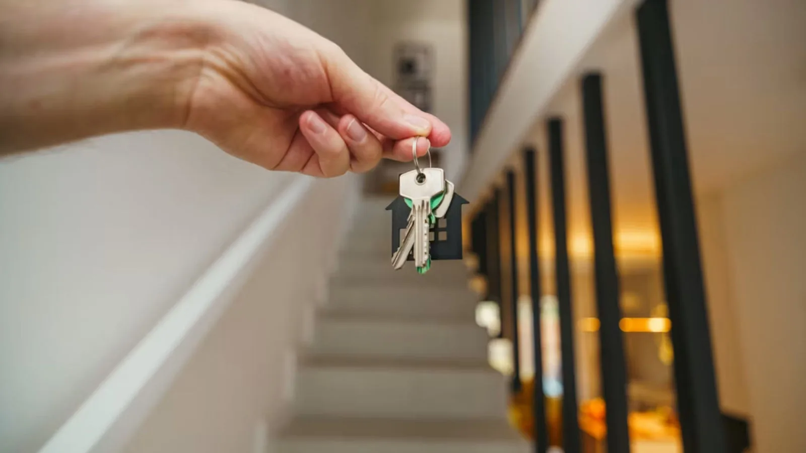A hand holding a set of keys