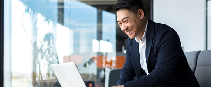 Asian businessman working on his computed.