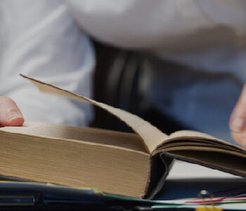 Employee flipping through her handbook