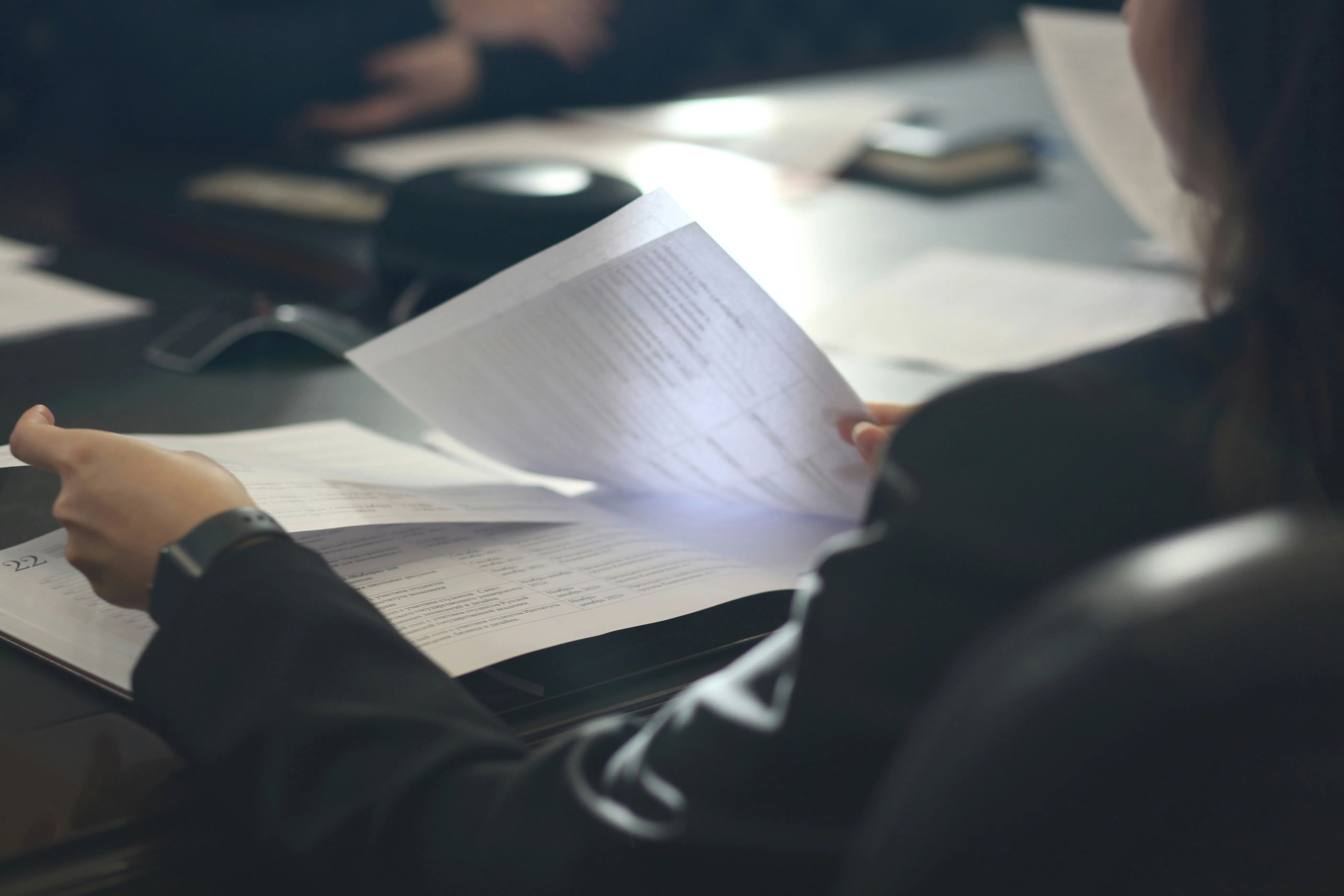 Someone looking through papers