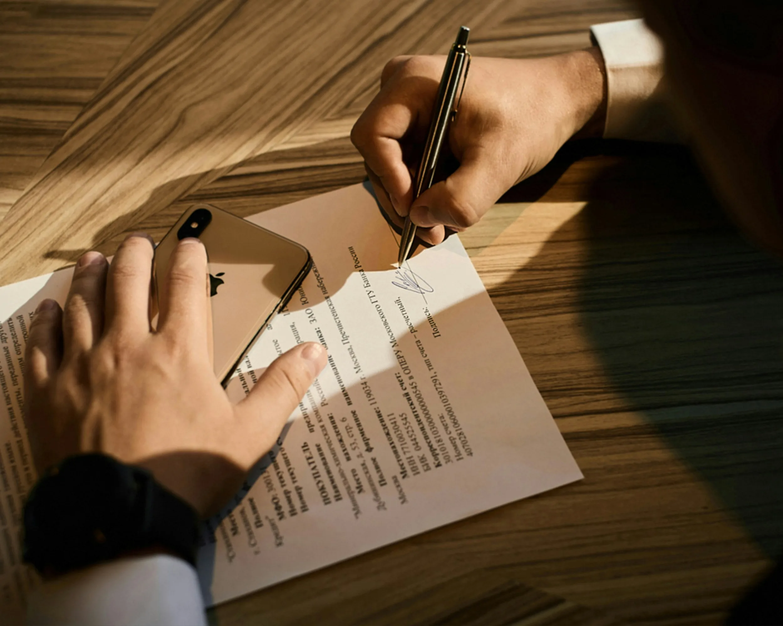 A man signing a document